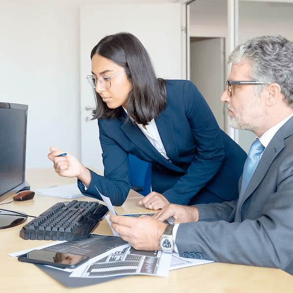 Two colleagues working through a plan together